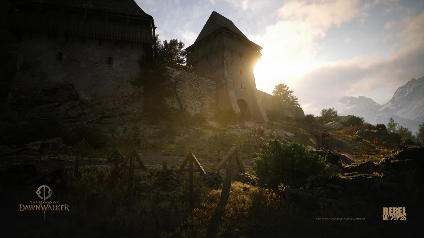 Official view of a mountain castle with morning light rising behind its stone walls and towers